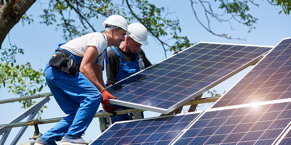 Image for Men installing solar panels